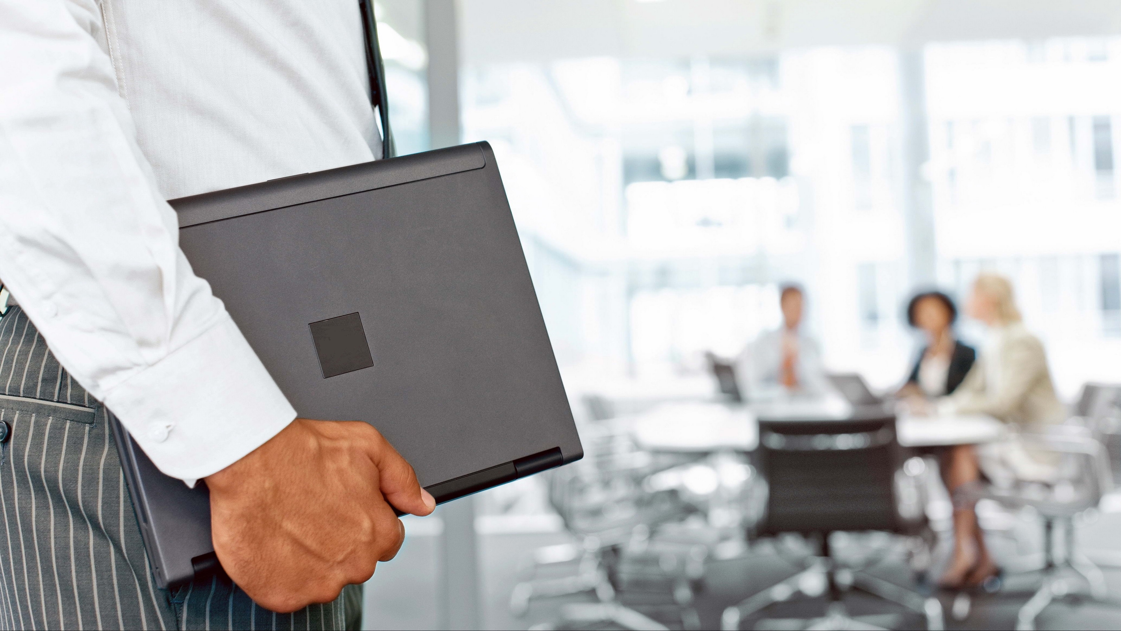 A Corporate Service Man holding his business files